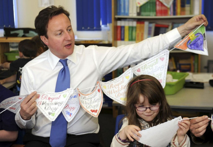 Britain's Prime Minister David Cameron helps pupils make royal bunting at the English Martyrs primary school in Manchester, northern England Britain's Prime Minister David Cameron helps pupils make royal bunting at the English Martyrs primary school in Manchester, northern England