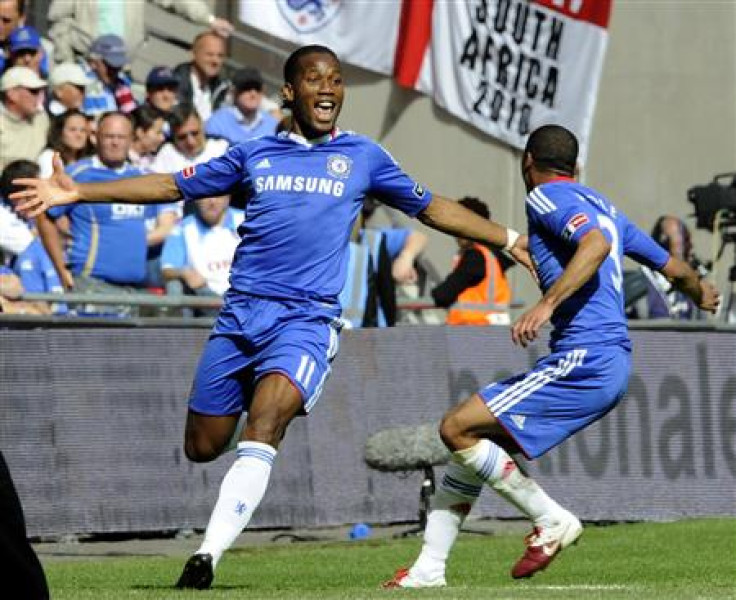 Ashley Cole celebrates with Chelsea's Didier Drogba (L).