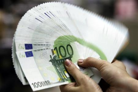 An employee counts Euro notes at the Bank of Taiwan head office in Taipei
