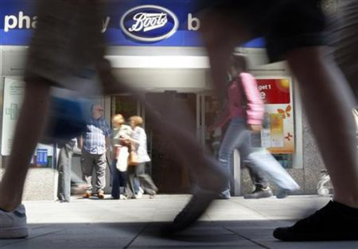Pedestrians walk past a Boots branch in Leicester, central England