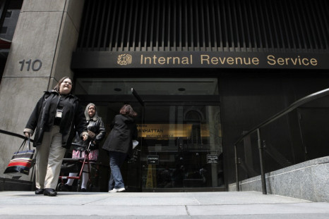 Women walk out of an Internal Revenue Service office in New York April 18, 2011.