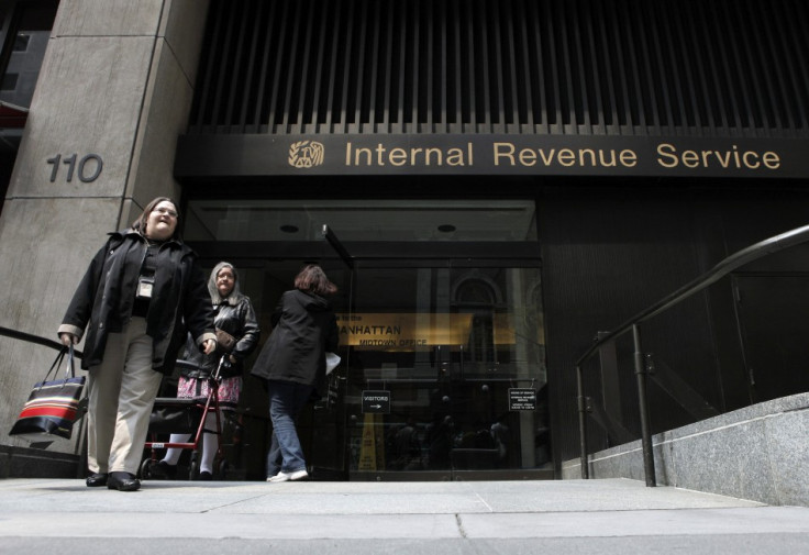 Women walk out of an Internal Revenue Service office in New York April 18, 2011.