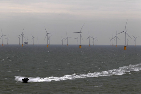 A boat powers past the Thanet Offshore Wind Farm off the Kent coast in southern England September 23, 2010