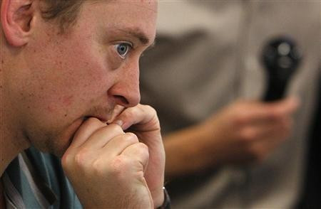 A broker trades sterling swaps at ICAP in London