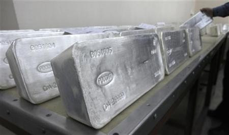 A worker stores ingots of 99.99 percent pure silver, which weigh 30 kilos (66 lbs), to pack them at the Krastsvetmet nonferrous metals plant in Russia's Siberian city of Krasnoyarsk. A worker stores ingots of 99.99 percent pure silver, which weigh 30 kilos (66 lbs), to pack them at the Krastsvetmet nonferrous metals plant in Russia's Siberian city of Krasnoyarsk.