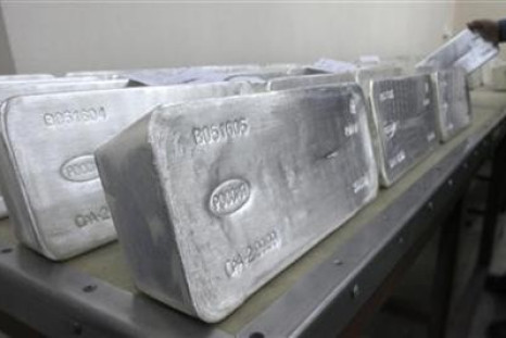 A worker stores ingots of 99.99 percent pure silver, which weigh 30 kilos (66 lbs), to pack them at the Krastsvetmet nonferrous metals plant in Russia's Siberian city of Krasnoyarsk.