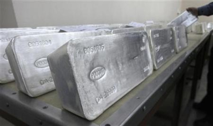 A worker stores ingots of 99.99 percent pure silver, which weigh 30 kilos (66 lbs), to pack them at the Krastsvetmet nonferrous metals plant in Russia's Siberian city of Krasnoyarsk.