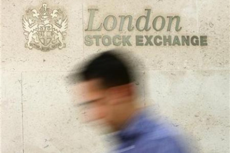 A man passes the London Stock Exchange in central London
