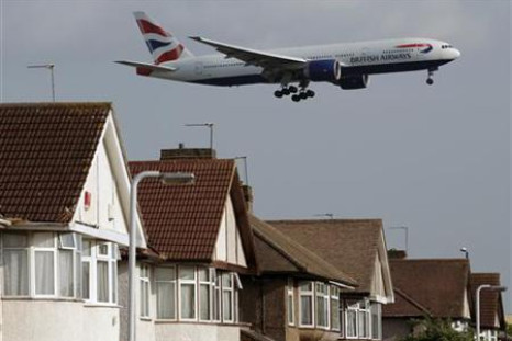 A British Airways plane lands over homes near Heathrow Airport in London