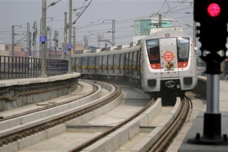 A Delhi Metro Rail Corporation (DMRC) train runs on its tracks after being flagged off for its trial run in Gurgaon, India, Friday, Jan. 29, 2010. The DMRC conducted its first trial run of the under-construction 27 kilometers (17 miles) long Central Secre