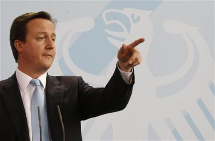 British Prime Minister Cameron addresses media in Berlin
