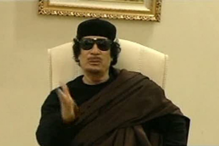 Still image from a video shows Gaddafi gesturing as he speaks at a Tripoli hotel