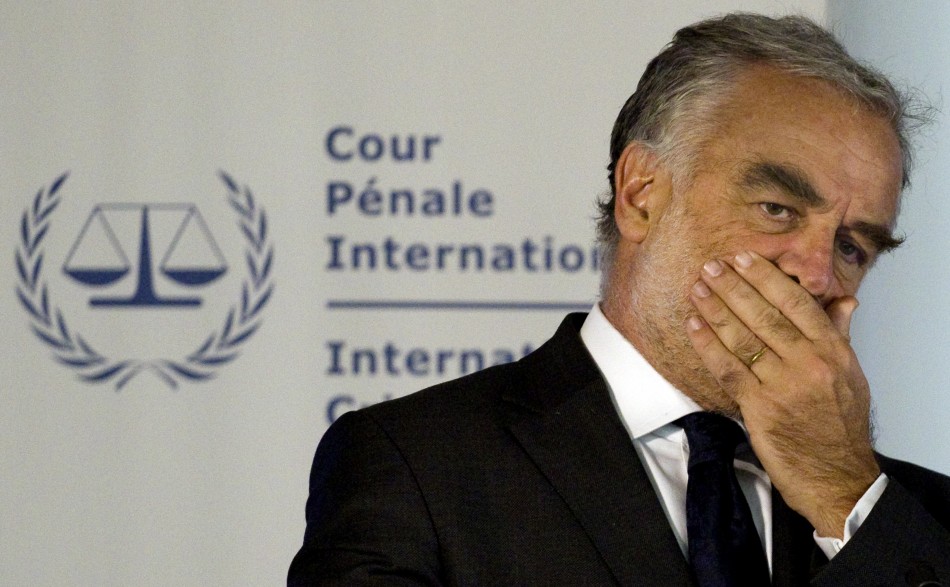 ICC chief prosecutor Luis Moreno-Ocampo listens to questions at a news conference in The Hague