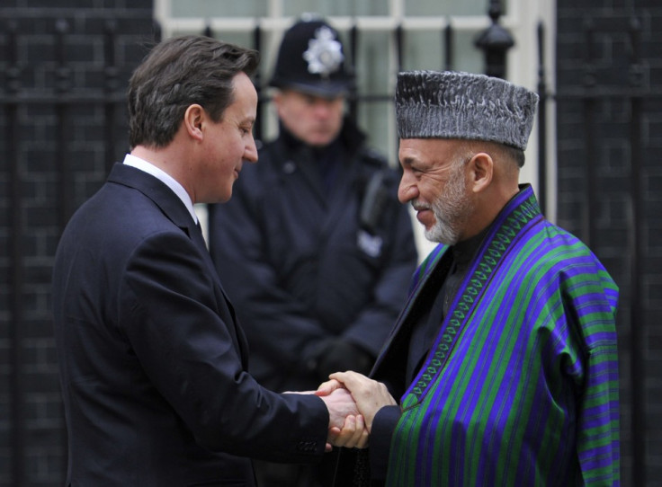 Britain's Prime Minister Cameron greets Afghanistan's President Karzai outside Downing Street in central London