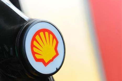A Shell logo is seen on a pump at a petrol station in London